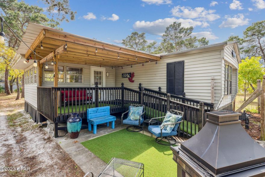 ''CURRENTLY UNDER CONTRACT, SELLER WILL CONSIDER BACKUP OFFERS.'' This tastefully renovated 3-bedroom, 2-bathroom home is truly fantastic, fully furnished, & conveniently located near the beach - all for an amazing price of under $200k! Recent updates include new central heating and air conditioning, duct work, & a new roof on the front porch. Additionally, the Florida room has been insulated to add extra living space, while a new large island & barn doors add a touch of style. Whether you're looking for a second home or investment property, this gem is perfect for you. Nestled at the end of a private road surrounded by serene woods, only a short 4-minute drive or 5-minute bike ride away from Thomas's Donuts, Carousel grocery store, & the stunning emerald beaches.