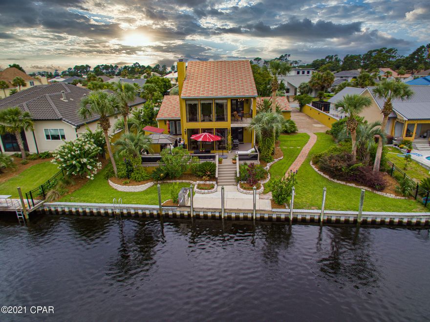 CURRENTLY UNDER CONTRACT, SELLER ACCEPTING BACKUP OFFERS. Looking for a home to elevate your lifestyle? Need room for your yacht, jet-skis, cars, clothes, entertainment? Don't miss this gem on the water in Bay Point that is priced under $1M! This gracious 4/3 home is located in a cul-de-sac, and features protected mooring for your yacht on 100' of deep-water canal with direct access to the Gulf. The 2020 concrete tile roof adorns this home designed for outdoor entertaining, with a central courtyard, sweeping deck with three levels overlooking the canal, with a bar and gazebo. A circular drive and a street-side pad allow parking for at least 10 cars, and there is a 25X20 garage. As you enter, a dramatic 22' gallery foyer leads up to an expansive Owner's Suite, which occupies the entire 2nd floor. A 19' ceiling towers over the main bedroom and ensuite, while a wall of windows and two French doors provide abundant natural light. Step outside to a private 14 X 9 vaulted, covered terrace overlooking the canal. Huge closet with five compartmentalized organizers, and a separate closet for shoes and handbags. Downstairs, the 27' Great room features 9' ceilings, five floor to ceiling windows overlooking the canal, a fireplace, and a wall of custom built ins with a wet bar and lighted cabinet storage. The chef's kitchen boasts Kraftmaid cabinets with accessories such as roll out shelves, baking center, plate rack, breadbox, cutlery divider, pot and pan drawers, and a tray divider. Stainless steel appliance suite including a $2600 GE Advantium speedcooker/microwave oven, built in convection oven, cooktop, and GE telescoping downdraft vent.

Two ground floor 13 x 13 bedrooms, each with a large walk in closet,  share a remodeled Jack and Jill bath. The 4th bedroom/office has a wall of built in drawers, shelves, and closets, French outswing doors to the courtyard, and is currently being used as a media room. Full bath adjacent.

This is one of just a handful of homes in Bay Point with a grandfathered 6' stucco lighted perimeter wall. Come see what's new, paint, doors, windows, carpet, tile, tiled baths, vanities, faucets and fixtures, etc.

Two AC units, one replaced in 2017. Riccar central vac in 2019. Two attic storage areas, storage closet under the stairs. Sprinkler system, 50 amp shorepower. Transferable termite bond with Terminix. AHS Home Warranty thru 8-11-21.

Extensive landscaping with palms, crepe myrtles, bougainvillea, camellias, gardenias, magnolias, oleanders, hibiscus, passionflower and perennials.

Great neighbors! Bay Point is a premier gated community with roving patrols, a new marina under construction, a community garden, numerous clubs, restaurants, a championship golf course, tennis courts, a golf cart friendly community, and memberships are available to the AAA Four Diamond Bay Point Sheraton. Superb market location near beaches, fishing, recreation, and the areas best shopping and dining. 


INFORMATION CONTAINED HEREIN IS DEEMED RELIABLE, BUT NOT GUARANTEED AND SHOULD BE VERIFIED BY BUYER. SUBJECT TO ERRORS, OMISSIONS, PRIOR SALE, CHANGES OR WITHDRAWALS WITHOUT NOTICE.
