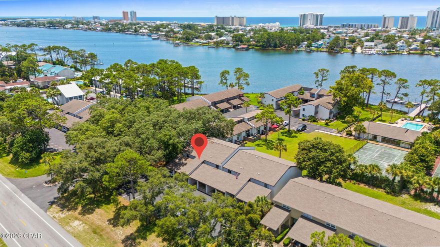 Welcome to Palisades! This well maintained unit has been freshly painted, all LVP flooring, updated showers, HVAC has been routinely maintained and move-in ready. Long Term rental history is excellent.  Palisades offers a community dock with short term boat slip access, rec room, great location to Thomas Drive restaurants, and within minutes to beach access. Central location to all Panama City Beach has to offer. This unit is on the ground floor and has 1 covered assigned parking space, 2 bedrooms, 2 bathrooms, and an outdoor patio. There are guest parking spots located directly across from the unit. Owners can enjoy access to the community dock, where you can park your boat for temporary use after a day on the water. The unit is being sold in as-is. Adorable unit and ground level. Buyer to verify any information deemed important. All information is approximate.