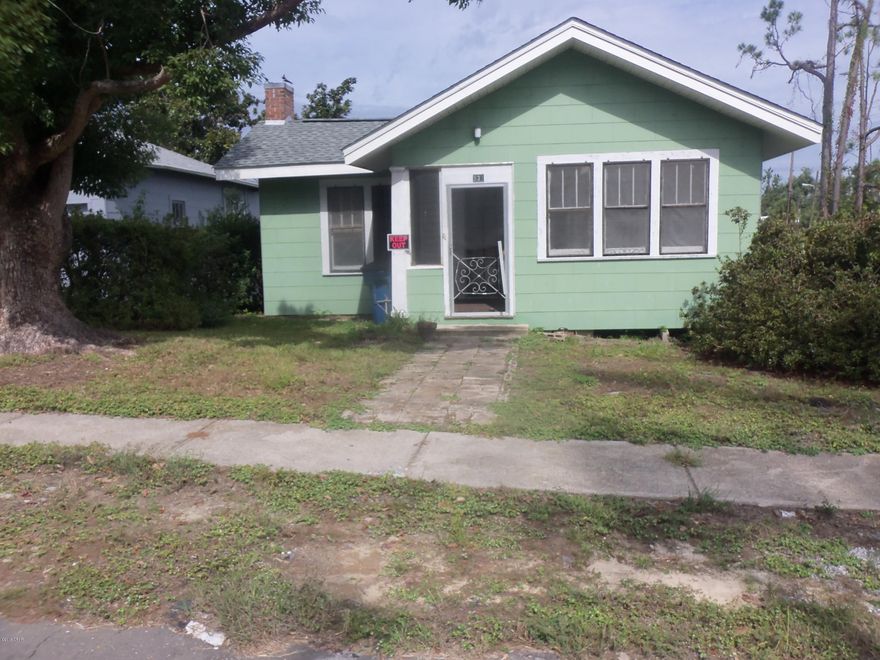''Cove'' Cottage - near 100 years old - Selling ''AS IS''. New Roof  after Hurricane Michael. Large corner lot with commercial potential (backing up to BUS US HWY 98 (6th Street). Home has been owned by same owner family for over 80 years and was rental the past 30+ years. Very basic and original - dated - but with old time character and features. Needs work and updating - but could be livable in short order - appears to have good bones. SELLING AS IS - May not qualify for some mortgages. A Great HGTV- type FIXER-UPPER - with lots of potential - especially with commercial exposure and large corner site. Block is Zoned GC-1 - allows Residential. Flood Zone X (Flood Insurance NOT required).