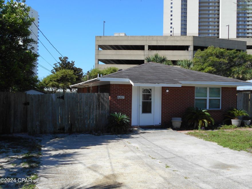 Super location on Panama City Beach.  Located just 1.5 blocks from the Gulf, this ''all brick'' home is need of a complete rehab.  Home has good bones, just needs someone to love it again. Sitting on a 60x120 lot, you are just a short stroll to beach access #63, and the emerald green waters of the Gulf of Mexico. A true diamond in the rough, and priced right.  Meas. are approx.