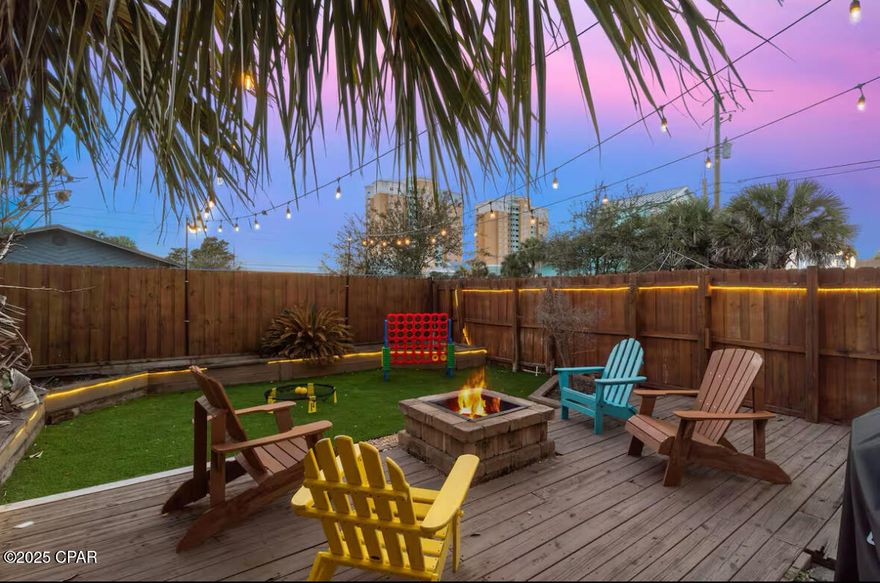 'CURRENTLY UNDER CONTRACT, SELLER WILL CONSIDER BACKUP OFFERS' EXCELLENT RENTAL INCOME !! Gross Rental Income numbers for both 2024 & 2025 at $77k. GRI. PRIME Location! Welcome to your beach-side escape! Perfectly positioned only 300 yards from the sugar white sands of Panama City Beach! NEW Roof installed 2023! Located on the East End of PCB, this stunning town-home blends modern coastal style with comfort and fun. Just a block from Rick Seltzer Park and the crystal-clear Gulf waters, you'll enjoy quick beach access, ocean breezes, and the sound of waves all day long.
Step inside to a light-filled, open layout that sleeps up to 12 guests comfortably. Every detail has been beautifully updated—floors, counters, baths, lighting, and décor—making this home truly turnkey. Multiple patios and balconies invite you to unwind outdoors, with a peek-a-boo Gulf view and the scent of salt air in the breeze.
Outside, the large fenced-in yard is your personal oasis—complete with a fire pit, lawn games, ping pong, and outdoor showers for easy beach clean-up. Evenings come alive under string lights while you enjoy a cool drink and the coastal night air.
Inside, you'll find a modern kitchen with a coffee bar and island seating, a spacious dining area, and a cozy living room—perfect for gathering after a day on the sand. Upstairs, three inviting bedrooms include a private primary suite, a guest room, and a fun bunk room the kids will love. Top Features: Just 300 yards to the beach, Custom fire pit + lawn games, Game garage w/ ping pong & arcade, Outdoor showers, Patios w/ smart TV for movie nights, Fenced yard for kids & pets. Prime Location: 100 yards to Finn's Café & Taco Bar,
2 miles to Schooners & Walmart, 5 miles to The Pour Coffee Shop, 8 miles to Pier Park.

Whether you're seeking a family retreat or a high-performing vacation rental, this home has it all—coastal charm, unbeatable location, and endless amenities. Experience the best of Panama City Beach living—schedule your showing today!