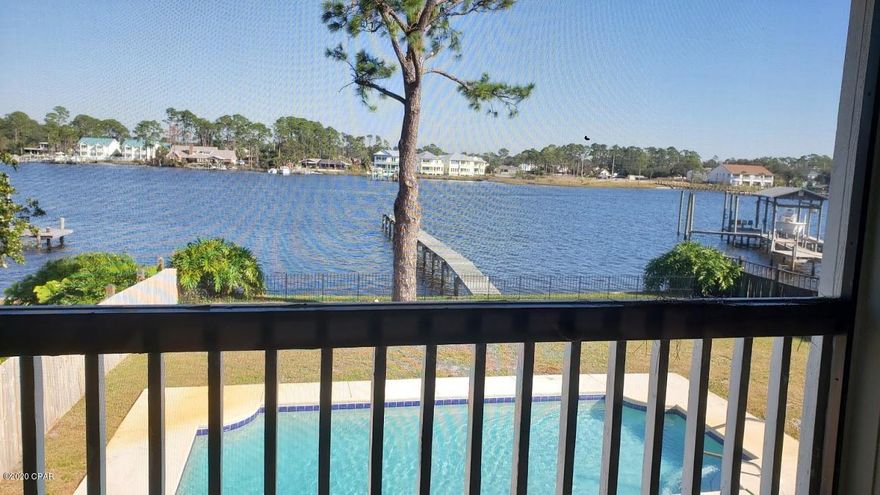 Large lagoon front home with 4 bedrooms and 6 full baths. Each of the 4 bedrooms have their own bath. There are also 2 full baths downstairs. You can relax in the back yard in the pool and watch the fish jumping in the lagoon.  This is a great place to call home or to have as a vacation home.  This property has 2 kitchens. Very easy to have guests and stay separate. It is so convenient to be able to dock your boat at your back door.  All measurements are approximate. If important, please measure. Make an appointment to see this home today!