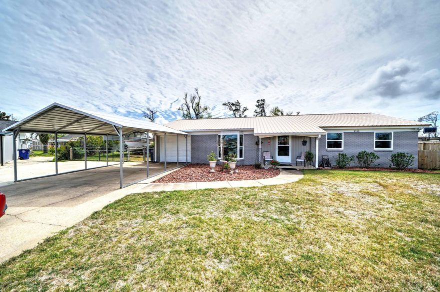 Centrally located 3 bed/2 bath home in a peaceful neighborhood off 23rd St. Hosting friends and family is a pleasure in this open living/dining room/kitchen floor plan. The living room is adorned with a beautiful bay window that lets in plenty of natural lighting and gives a great view of the front yard landscaping. The master bedroom is spacious with an updated en suite. The master bath features a tiled shower with a glass door and upgraded vanity. The two guest bedrooms share a full bathroom with a shower/tub combo and features white subway tiles. Sliding glass doors off the dining area lead to the covered patio and the very spacious, fenced backyard. There is a fire pit, shed, and metal carport for RV and boat parking in the backyard. There is a one car garage for extra storage space. with washer and dryer hook-ups. This home is located near schools, parks, shopping, restaurants and more.