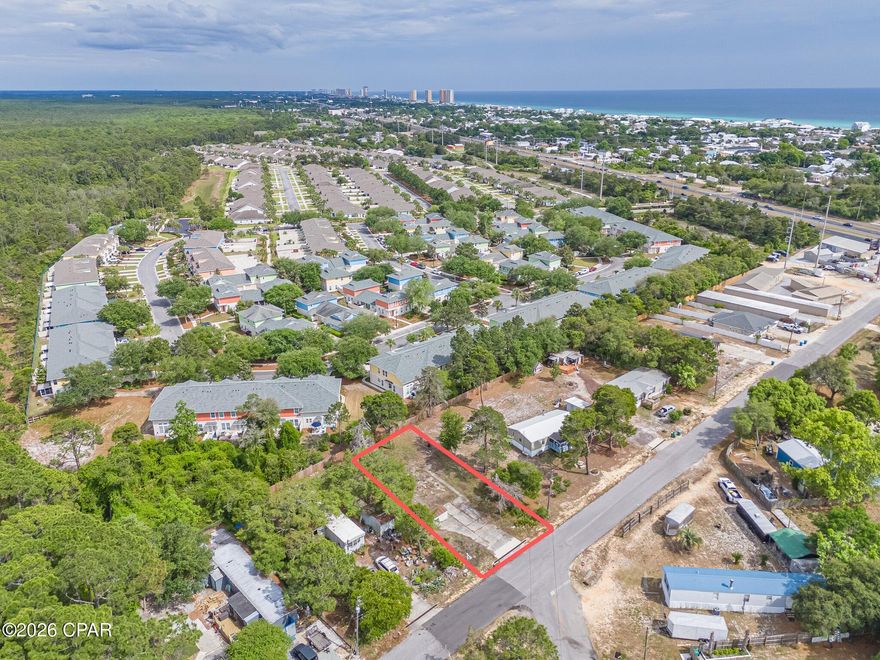 Situated on a quiet street on the highly sought-after West End of Panama City Beach, this high-and-dry homesite offers level, even dimensions and a driveway already in place. Zoned R-2, the property provides excellent flexibility for a primary residence, second home, or investment build. A large septic system is already installed, adding immediate value, and a metal shed conveys with the sale. Ideally located just minutes from Lake Powell and a short drive to the beach, 30A, shopping, dining, and grocery stores, this lot combines convenience with the quiet coastal lifestyle the West End is known for.