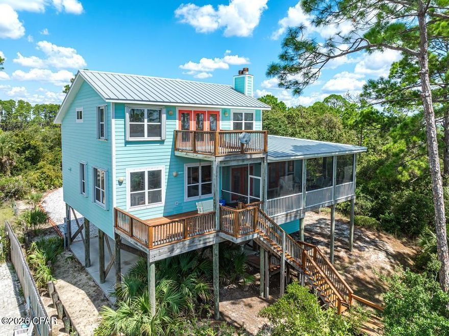 Don't miss this rare 2.5-acre Gulf-front opportunity on Indian Pass - one of the largest and most versatile residential parcels currently available in this unspoiled coastal market. With 80+ feet of direct beachfront and significant depth, this property offers exceptional flexibility for future expansion, redevelopment, or potential subdivision into multiple homesites. The existing residence is a well-built 3-bedroom, 2.5-bath home with 2,292 sq ft of living space, blending Old Florida charm with modern updates. Recent improvements include a fully renovated kitchen, 10' ceilings, new ceramic tile flooring, expansive porches, a cargo lift, and a new standing seam metal roof. Built by respected Windolf Construction, the home is ideally positioned on the parcel to preserve privacy while maximizing the remaining acreage for future use. Indian Pass is known for its unspoiled natural beauty, laid-back atmosphere, and countless outdoor activities. Whether you're into fishing, hiking, boating, paddling, exploring, or simply relaxing by the water, this location has it all. Enjoy life away from the chaos while still having quick and easy access to nearby charming towns of Port St. Joe and Apalachicola for shopping, dining, and entertainment. Call to schedule your property tour!