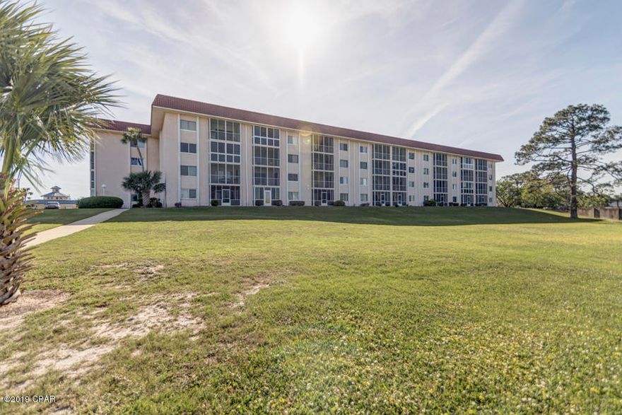 Lowest Priced 2 bedroom 1 bath unit in the Colony Club Leisure #1 Condo. This unit is on the 1st Floor easy access from the parking lot or the pool located in the back of the complex. Leisure #1 condo adorns the Holiday golf course and driving range to get out and enjoy the links!  The location is centrally located in Panama City Beach with all you need shopping east or west!.   Not to mention just a short easy walk to the community pool.  The condo has an easy living screen in porch to enjoy the Florida weather.  Get out and enjoy nature trails  by walking or biking at Gail's Trails just a short distance behind the complex.  This floor plan is unique as it can easily be converted to a one bedroom or a 2 bedroom with a quick pull of the accordion wall.  No Short Term Rentals