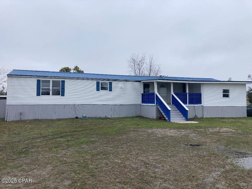 Back on the Market! Like New Re-Mod.  Vinyl floors, nice cabinets, cool ceiling fans,, 4 bedroom home on large lot - barn doors to master bath, tiled showers, large master bedroom, storage area under front deck, access to below the home on two parts. the lot is over a half acre - and fenced