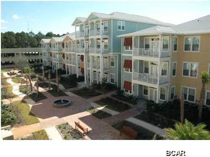 LOWEST PRICE IN ISLAND RESERVE.  Large one bedroom two story condo is serene and spacious with luxurious features like bamboo floors, gourmet kitchen, terra stone tiles, soaring ceilings, crown molding, walls freshly painted, new carpet and stylish lighting. The beautiful emerald coast inspired the exterior colors that seamlessly flow into the lush landscaped courtyards. Whether this is a vacation home or your new private residence, you can enjoy resort amenities in this upscale resort community. This gated community features a 1 acre resort style lagoon pool with rock waterfall, lap pool, children's play area, restroom facility and plenty of lounge area. There is also a clubhouse equipped with a state-of-the-art fitness facility, a half-court indoor basketball, volleyb
