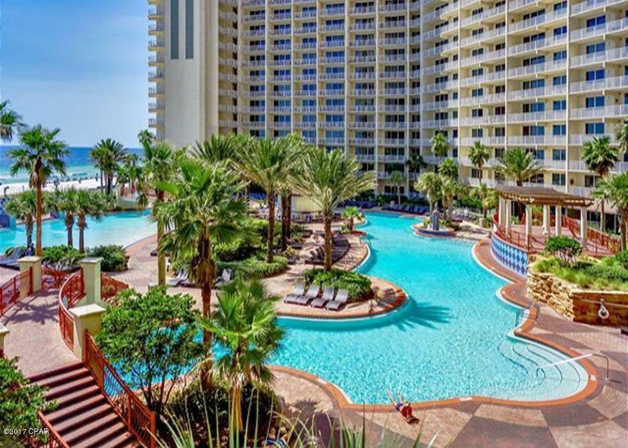 Don't miss out on this rental ready 3 bedroom, 3 bath gulf front condo with bonus bunk room and a designated parking space on the 5th floor. This unit generates great rental income and stays booked year round. Amenities include a lush landscaped tropical oasis that is home to a 14,000 square foot lagoon pool, over sized hot tub, poolside snack/tiki bar, bbq pits, indoor heated pool, fitness center, private owners lounge and game room. FINANCING IS AVAILABLE.