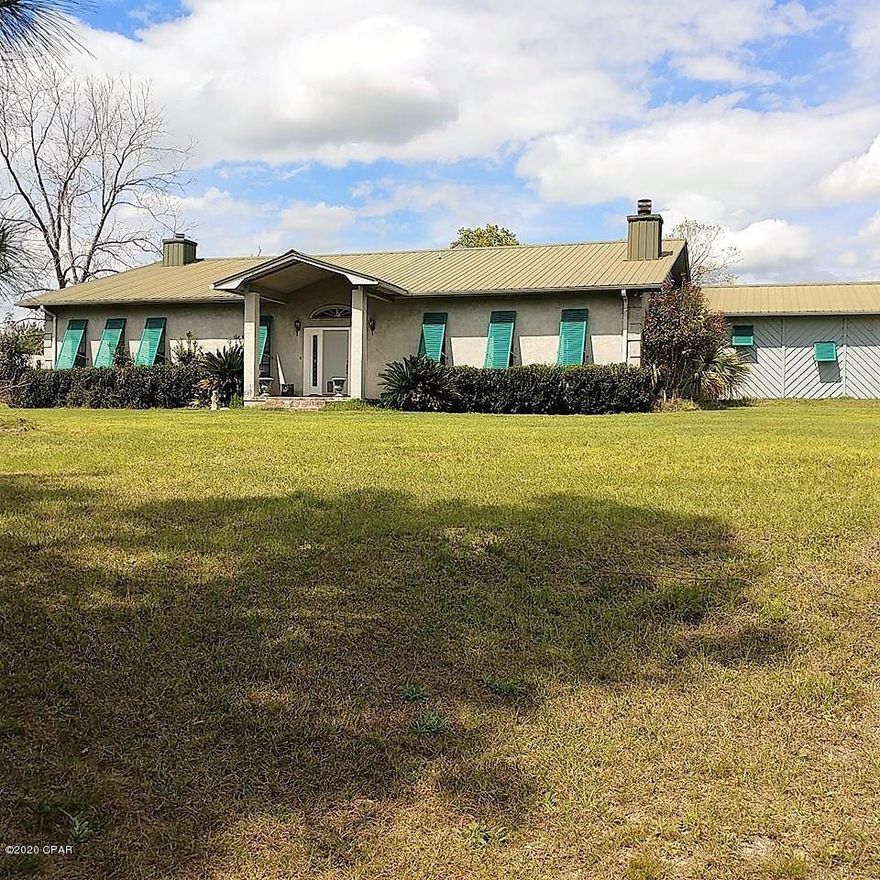 CURRENTLY UNDER CONTRACT, SELLER ACCEPTING BACKUP OFFERS.   Welcome home to your own country estate on 40 high and dry acres with beautiful views !! Recently remodeled 3-bedroom, 2-bath home with 3168 square feet,  a 2-car attached garage, and 3 custom, wood-burning fireplaces.  Open kitchen/dining area with a lot of counter space/cabinets and an island that features a nice cooktop. The dining area has a wood-burning fireplace and double-doors leading to the back, covered patio and the 32'x14' in-ground, fenced, concrete pool with spa - perfect spot for spending time with friends and family. From the kitchen, step down to the huge 26'x24' open Family Room with fireplace. Features a massive master bedroom with beautiful fireplace and a large walk-in closet.  Roomy master bath with custom, walk-in shower. Split-bedroom floor plan. Large mudroom with cabinets and a separate laundry room. Garage doors, well pump, and pool pump are all new.  Outside you will find a huge 6-bay, 2400 square foot barn (100'x24' on slab) with a 12'x24' shelter on the end of barn.  Barn has power and water available.  There is also a Metal Shop/Work Building (50'x30' on slab with 50'x12 shelter on the side) with a nice office space and 1/2 bath set-up inside. The Shop has a separate entrance and mailbox. Property has approximately 20 acres of planted pines and 18 acres of pasture.  So many possibilities and plenty of room to expand.  Make this showplace your own !!