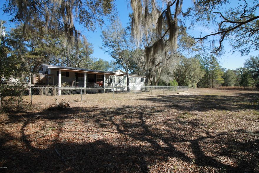 Beautiful acreage with a 10 horse barn, extra Tack building and Riding Ring, also has double wide mobile home. Beautiful property close to Hicks Lake Bring your family for weekend get away. This home is easy to show. Mobile home needs some TLC but nothing major.