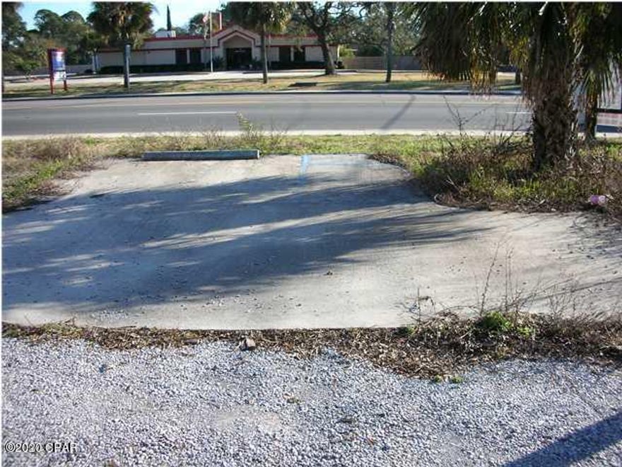 Income Producing Vacant Commercial Lot on busy 15th St! This is an incredible opportunity for a centrally located commercial lot (zoned GC-1) on a major 4 lane highway, US 98. The property currently, has a partial lease being used for overhead billboard advertising. Thousands of people pass by this property daily (FL DOT Traffic Counts 40,000+/- cars pass there per/day) making this site very viable for any type of business. Don't miss out! All measurements are approximate, buyer to verify.