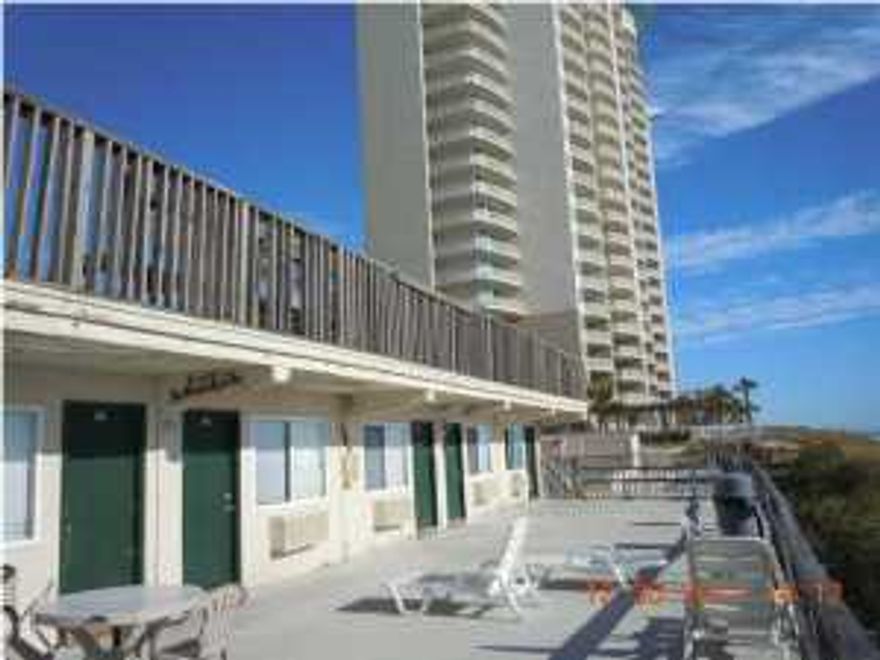 This is a Wonderful chance to have a Gulf front property at a reasonable price! The sand is just as white, the seas just as blue as the most expensive real estate on the beach! But here you get less density and more sand for yourself! Sit back and enjoy the money you saved! This property is legally structured as a ''cooperative.'' This is a low rise project with only two stories! Enjoy the pool, shuffle board, or just grill out on the balcony. Don't feel like cooking at home? Pier Park is just 200 yards to the west! This structure was a motel, converted to Cooperative form of legal arrangement, consists of a 330 Sq. Ft. efficiency unit, with kitchen area and bathroom, know on site as room 102. (They did not use legal unit numbers) (NOTE: there is a land lease under the property with