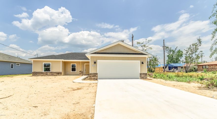 Brand new craftsman style home built after Hurricane Michael!! This Suzanne Vickers built home is centrally located in Lynn Haven across from public walking park & kids splash pad. This 3 bedroom /2 bathroom built home has an open floor plan and two car garage.  Custom cabinets, Quartz counter-tops, stainless steel appliances and

large kitchen make this home an entertainer's dream. Additionally, there is a nice fenced in backyard ready for your weekend grilling. This new home has fresh new sod and a sprinkler system.  Come see this Suzanne Vickers craftman's home today.