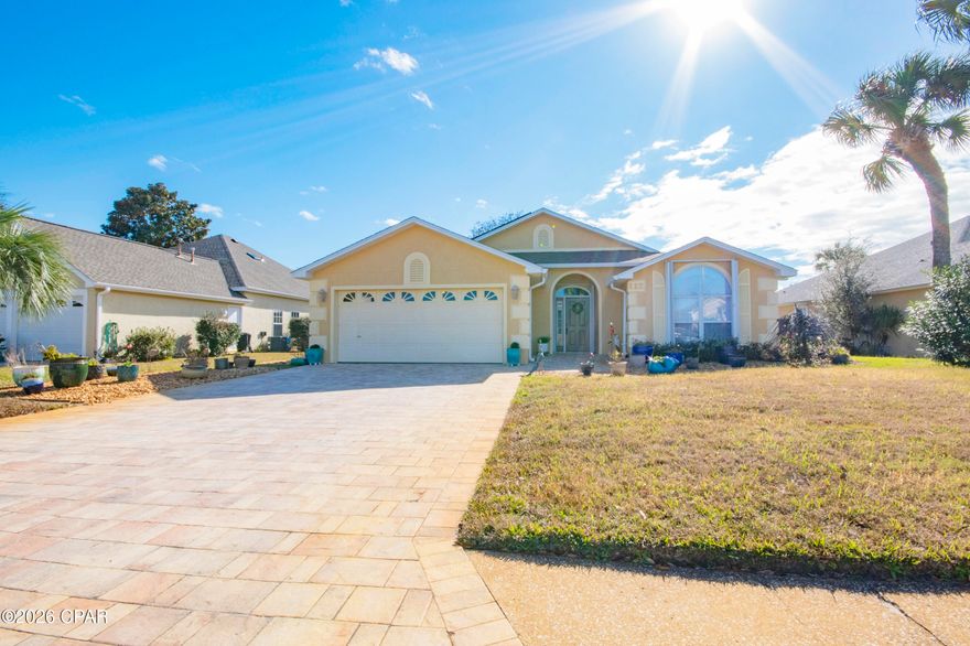 Located on a quiet Cul de sac in the sought-after Summer Breeze community. This spacious 3-bedroom, 2 bath, 2 car garage home offers the perfect blend of comfort and convenience just a short stroll from the Gulf of America's stunning white sand beaches and emerald-blue water. The spacious kitchen is perfect for families who love to cook, offering abundant counter space, generous cabinetry, and a comfortable breakfast area. Open Dining and Living Room area are accented with a gas log fireplace and have easy access to the large, screened room over-looking the spacious fenced backyard. The sprinkler system with a private well helps to maintain the property's landscaping. The generous sized primary bedroom opens to the screened room, providing an ideal space to unwind. The en-suite bath includes a whirlpool tub, separate shower, double sinks, water closet, and walk in closet. The home also has hurricane shutters, new roof (2025) Summer Breeze is a golf-cart, pet friendly community known for its frequent social events, fostering a welcoming neighborhood atmosphere.  Conveniently located near Pier Park, restaurants, entertainment venues, and the beach, with easy access to the airport. ALL MEASUREMENTS ARE APPROXIMATE AND SUBJECT TO ERROR -IF IMPORTANT BUYER MUST SELF-MEASURE. 3-ton Heat Pump-installed 2022.  The Twin bed and dresser in the Primary bedroom do not covey with the property. MOTIVATED SELLER-OPEN TO REVIEWING ALL REASONABLE OFFERS.