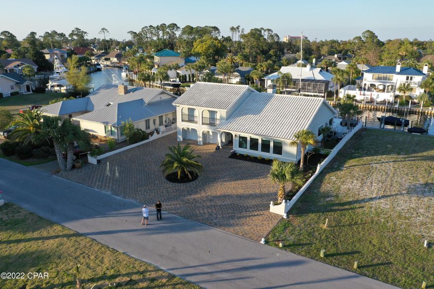 Beautifully remodeled. View of Grand Lagoon on front of property and Canal in back of property - before the bridge, so any height boat will work.