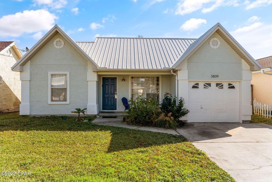 ***CURRENTLY UNDER CONTRACT. SELLER WILL CONSIDER BACK UP OFFERS*** RECENTLY RENOVATED 2BD, 2BA(W/1 CAR GARAGE) BEACH COTTAGE STEPS FROM THE BEACH New metal roof, new luxury vinyl plank flooring throughout, new window treatments, both interior AND exterior paint(includes new caulking and sealing), new lighting fixtures and ceiling fans, all new vanities, mirrors, dual flush toilets, new front and back door external lighting, new deep basin sink, new faucet, new stainless steel refrigerator, dishwasher, microwave and oven, new butcher block countertop and cabinet base, and new washer and dryer. Fenced in backyard in a great neighborhood. Walking distance to beaches, boat ramps, restaurants and bars. All info is approx. and should be verified by buyers if important