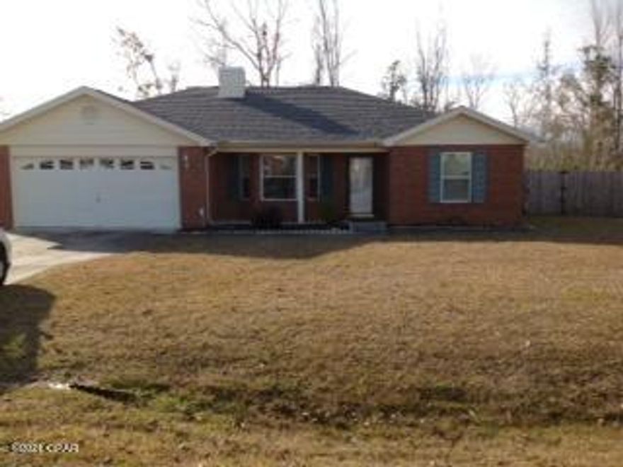 EVERYTHING IS NEW AGAIN! This 3/2 home has a  New Roof, New Kitchen with upgraded cabinets, tile back splash, granite counter tops, new grey wood laminate floors throughout. Beautiful fireplace, living room has bay window. Bedrooms have walk-in-closets French doors opens to a large screened patio overlooking a HUGE back yard with wooden privacy fence. Plenty of room to add a pool. Close to shopping and not far to Sugar Sand Beach.