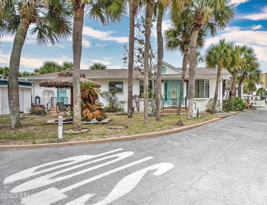 Super rare opportunity to own a stunning home on 2 lots in the private gated beachside community of Venture Out. This beautiful 3 bedroom, 2 bath home is spacious and has a great open floor plan. The kitchen is large and open to the living room. The home has new paint, flooring and the roof is 2019. The extra lot provides a tropical oasis that includes a koi pond and tiki style patio cabana. You will love the extra parking for your car or boat!  Excellent rental history and projections with 2023 rentals on the books. Venture Out is a golf cart community that has exploded with popularity recently. With 300' on the beautiful pristine beaches of the Gulf of Mexico and 1,000' on the Gulf!