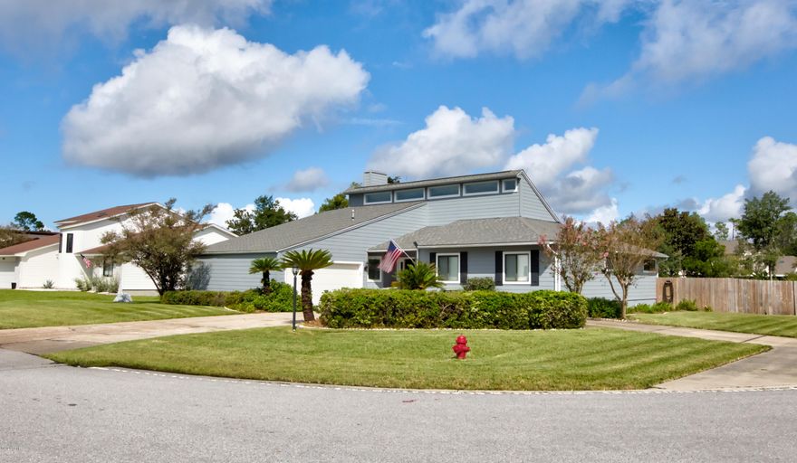 This 3 BR 2 B recently updated contemporary home is on a large corner waterfront lot in Northshore. Updated kitchen and appliances with a large bar to expand seating. The great room with a natural gas fireplace and built in book cases opens onto the large screened porch to provide lots of entertainment space.The gunite pool and firepit area provide even more area to entertain friends and family.. Waterfront Northshore homes are selling within days of listing. Call for a showing today.