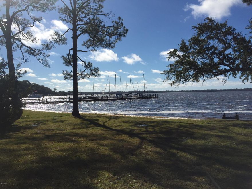 Fabulous waterfront lot overlooking St. Andrew Bay in Bunkers Cove, one of the most beautiful prestigious neighborhoods in Bay County. Perfect lot to custom build your dream home. Building a dock or boat house is permissible on this lot that has white sand beach at water's edge. Panama City Marina is just around the corner and Shell Island is just a very short boat trip away.