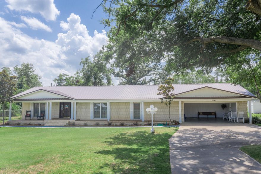 Wonderful Executive Home on large lot in Sneads. Home sitting on over 3 acres with great curb appeal. As you enter the foyer area you have formal living room and dining room. Spacious kitchen with abundance  of custom cabinets with breakfast area. Den has fireplace with gas logs. Master bedroom, walk in closet, separate vanity area just steps away from laundry room. You have a private patio area off master suite. Additional 2 bedrooms both with walk in closets. Spend your evenings entertaining on 24x26 screened porch steps away from 20x40 9ft deep inground pool. Outside utility room with full pool bath. 2 outbuildings, private well for sprinkler system and ease filling up pool. A Must See!!!!