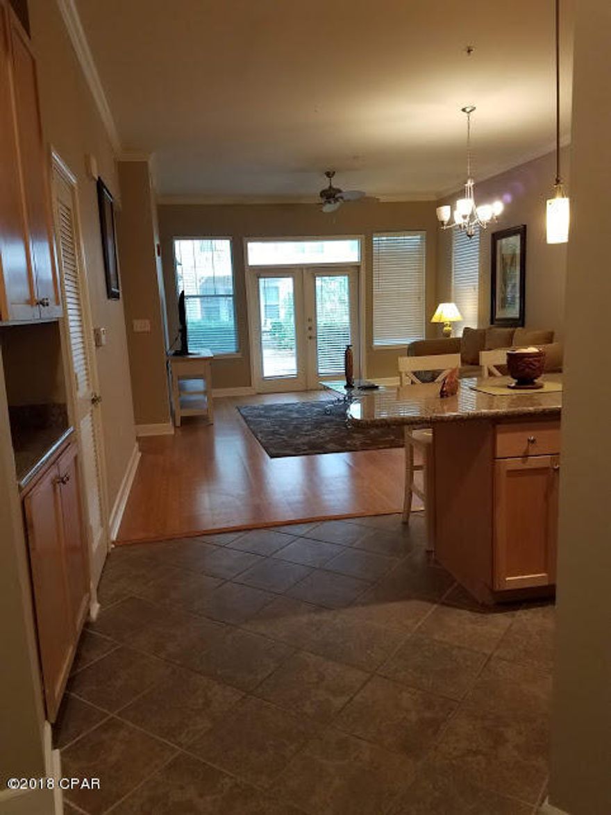 SURVIVED HURRICANE MICHAEL.  No leaks or damage. 

RARE GROUND FLOOR 1 BEDROOM!   Located in the much sought after building 6 with lush court yards and over sized covered patio. This unit also includes a bonus room with bunk beds, open floor plan, gourmet kitchen with tile floors, 10'ceilings, crown molding and stylish lighting. Large laundry room with full size W/D. No need for gym membership, your amenities include a clubhouse with state of the art fitness center, basketball court and game room. For those who like to swim after a nice workout, you can cool off in the 1 acre gorgeous Lagoon style pool with 2 water falls, zero entry area, lap lanes and splash pad for the kids. This gated community has security covered parking. Close to shopping, dining, fishing, golf, and beautiful beaches