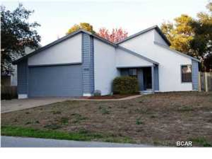 Welcome Home! This beautiful 3BR 2BA split bedroom floor plan features freshly painted exterior and interior accents, new floors in the large open living area extending to front entrance and hall way, vaulted ceilings, newly resurfaced fireplace, and new light fixture. There is a separate formal dining room and eat-in kitchen with updated cabinets, counter tops and tile floors. A must have is the expansive laundry room with plenty of storage room. The spacious master bedroom has a walk-in closet conveniently located next to the updated master bath. Enjoy the outdoors straight from your master sliding glass doors leading to the deck and huge back yard. The two additional bedrooms have nice size closets and wall-to-wall carpet. The second bathroom has been updated as well.