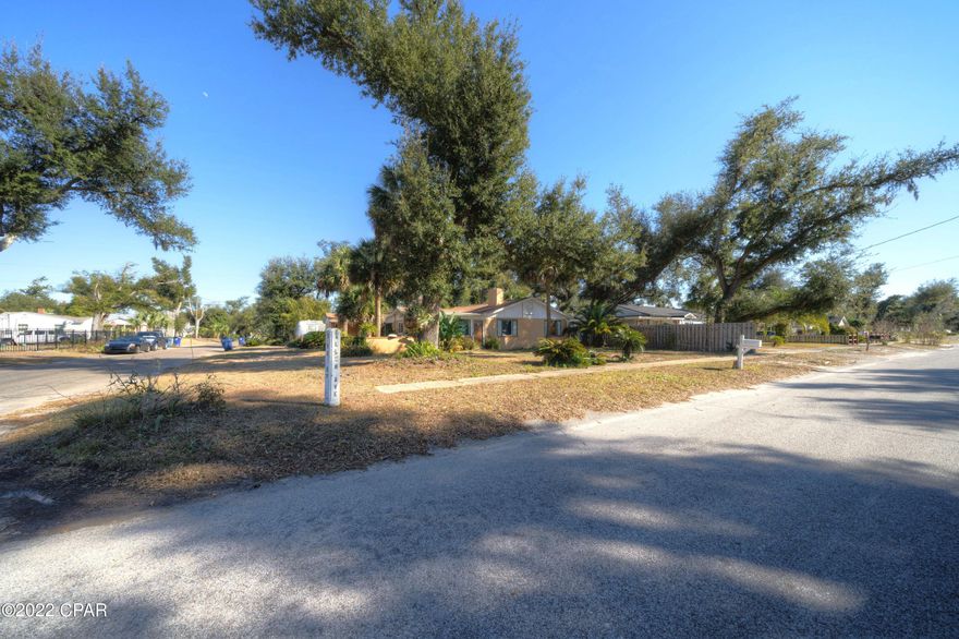 Charming Cove Cottage - This corner lot home is a 2 bedroom 1 bath home with an extra room that could be used for a home office or a bedroom. Garage could be turned into a master bedroom and bath, it has endless possibilities. This home is located close to downtown so that you could walk to town or the bay. The roof is covered with solid heart pine 1x6's, new insulation, concrete blocks that are filled with concrete, which helps with insulation,  3/4'' pine tongue and groove ceilings, new AC ducts, fireplace has a heatilator - once the firebox gets hot, the bottom of the fireplace takes cold air in and blows hot air out the top. This house has a lot that you don't want to miss, come see for yourself!