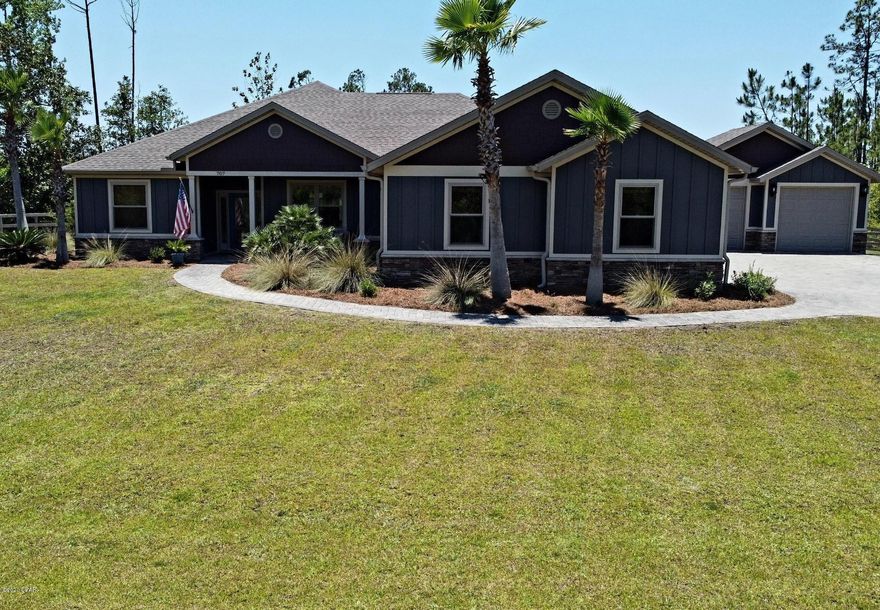 A Stunning Custom Build on 1.3 acres in the desirable Laird Bayou. This open concept floorplan is bright and modern with plenty of high-end features. Beautiful porcelain wood look tile and raised ceilings throughout entire home. The kitchen boasts all of the sought after upgrades such as an incredible island, custom cabinetry, granite countertops, soft close doors/drawers, and custom sink with apron. Home features an amazing dining space with nice windows. French doors off living space leads to a relaxing screened-in porch and covered patio with custom designed grill station. Master suite is very spacious with master bath offering a double vanity, powder station, unique custom shower, plus a spacious walk-in closet with built-ins. This is a 3/2 plus an office.... Beautiful craftsman trim and light fixtures everywhere you look. Guest rooms are nice sized with nice closets and are separate from the master suite. Laundry space offers beautiful cabinetry, extra counter space and a sink with storage. All baths and laundry room have granite countertops. 5.1 Surround speakers in living space and a second zone for patio. Oversized attached 2 car garage has 10ft doors and will accommodate full size lifted trucks, plus insulated doors to keep it cooler since current owners use the extra space as a gym. Detached 2 car garage has 10ft doors as well and offers plenty of space for additional cars and golf carts. Private deep well with water softener system and septic tank. No water bill!! Laird Bayou is a gated waterfront community that features a private boat launch, rv/boat storage, and a pool with bathhouse. All underground utilities. No waiting in lines at the marina to launch your vessel, Enjoy the beautiful waters of East Bay in seconds or take a short boat ride to Shell Island and the Gulf of Mexico. Great proximity to Tyndall AFB and a short drive to Mexico Beach. This home has been extremely well maintained and pride of ownership shows throughout entire property. Schedule your visit today!