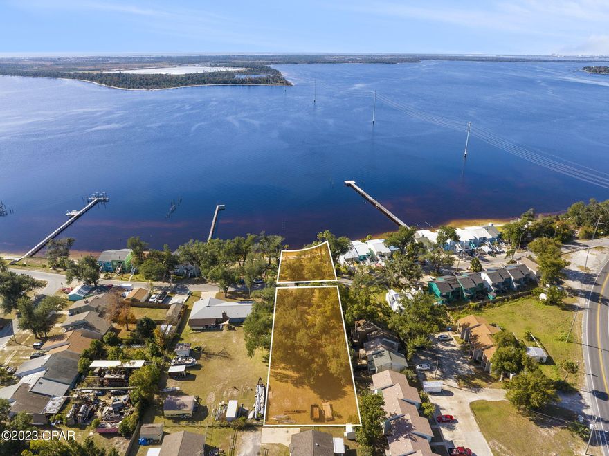 This is an incredible opportunity to own a large water front residential lot in Panama City!  Zoned in the city of Parker as Mixed Use 1. Boasting over 3/4 of an acre with plenty of room to build your dream home or an income producing property. The waterfront portion of the property is on the south side of Pitts Avenue with the larger portion on the North side. This is incredible value due to location to Tyndall and Downtown PC!