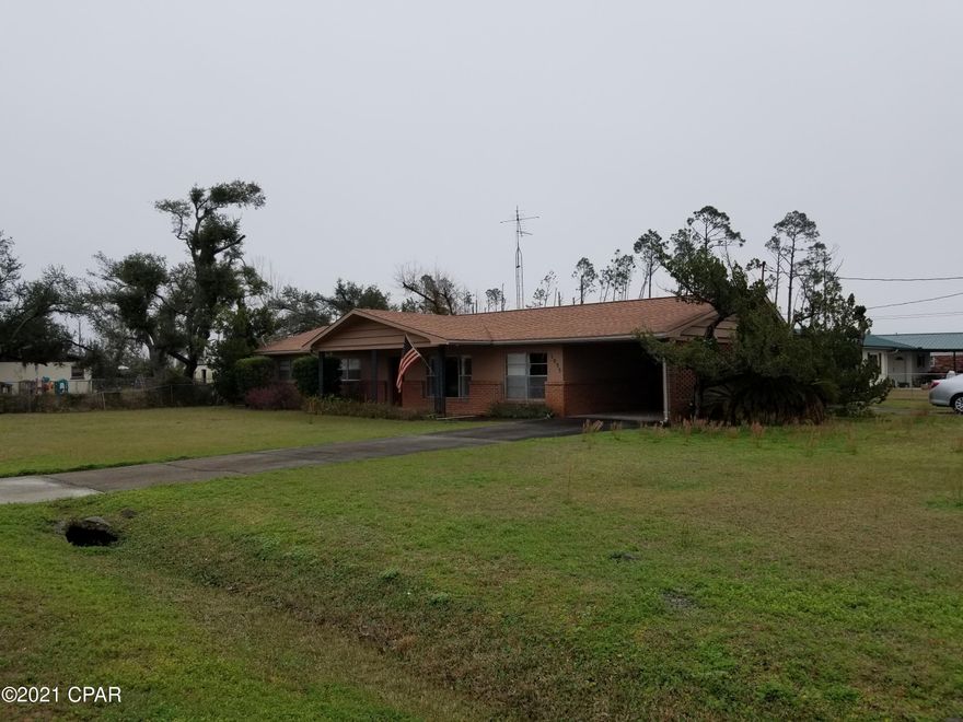 Great opportunity on this house that just needs a little TLC. The house has 3 bedrooms 2 full bathrooms with the master bathroom having just a shower only. The kitchen has real wood cabinets and lots of room and a separate dining area. The living room and family room, are large and a huge enclosed sun room. The house has two separate car porches attached to house, one in front and one on back side. House had a utility / laundry room. The house also has an outside garage for lots of storage or work shop. Sprinkler system on well, All this on a large corner lot. Still in the middle of moving out but please call for showing before its gone.