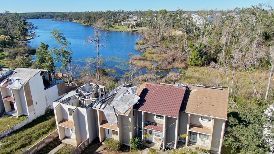 Investment opportunity, this home would make a great rental, this property is close to town, Tyndall and is a water front property. This home has a great view from the back decks. Ample parking plenty storage. this unit is for sale along with the other 3 in this quadplex. buy all 4!