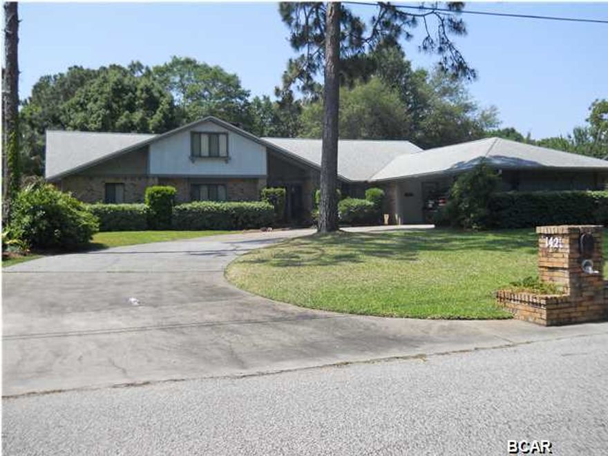 If you need space, this house has it. If you like well maintained inside and out or a very nice yard, this house has it. This 4 bedroom home offer a very open floor plan, split bedroom plan, 2 fireplaces (1 in the master bedroom), plus and upstairs bed, bath and den for the older kid. Roof was replace in the last 6 years, septic has been replaced in the same time frame. Property is located in Lynn Haven but has septic and well. No Water bill! The bedrooms are large, the family room has cathedral ceilings plus a very nice built in wooden bar. The kitchen comes equipped with solid surface counters, and updated appliances. This home is located just minutes from shopping, medical offices, good schools and more.