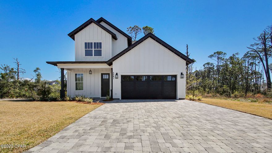 Live the Florida Lifestyle in the gated community of Sanctuary Beach; private and secluded yet close to PCB Marinas, Golf, Tennis, The Navy Base and the World's Most Beautiful Beaches! Your beautiful home comes with numerous upgrades including Hardwood Floors, Gourmet Kitchen with an Oversized Island, Quartz Counter tops, Gas Stove, Gas Tankless Hot Water Heater, Abundant Natural Light, upgraded Light Fixtures, French Doors in the Living Room that open up to your Covered Porch, 10 ft Ceilings Downstairs plus Tray Ceilings in the Living Room and Master Bedroom, Double Vanity in both bathrooms, and a Master Walk In Closet. Splash in the community pool which is located just around the corner or enjoy kayaking on the bay - The trail to the bay is located outside the gate! Welcome Home!