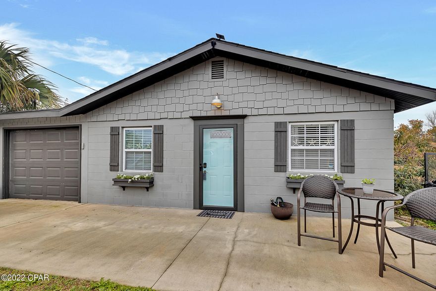 This adorable home can be turned into an AMAZING SHORT TERM RENTAL PROPERTY!! Just blocks from the white sandy beaches of Panama City Beach, Florida. Solid-block construction type makes for an extremely energy efficient home and has 3-bedrooms, 2-bathrooms, and a 1-car garage. The interior has been renovated with shiplap walls, crown molding, breakfast area with a built-in corner bench and storage, kitchen has plenty of cabinetry, all stainless steel appliances, with a large deep sink. Updated LVP flooring throughout and tile in the bathrooms. Backyard offers one of a kind entertaining area, with a pergola over deck, a Tiki bar, outdoor shower plus a HUGE shed (seller will be finishing the siding prior to closing). There's a separate laundry room in the garage, where you will also find the on demand electric water heater. Property is on city water and septic, located on Flood Zone AE, private insurance offered as low as $1,057. Sold UNFURNISHED. All information is deemed correct, buyers should verify if they are important.