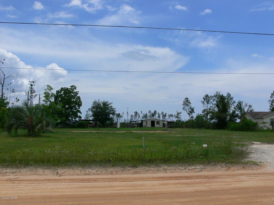 This is a great opportunity to own a beautiful 1.4 acre lot that's high and dry, it has a well, septic tank and power pole already in place. This property has pecan,pear,orange and persimmon trees along with grape and scuplin vines. It offers underground utilities, 24 x 12 shed/shop. Property's 20 min from Eastern Shipbuilding's Allanton yard, 24 min from Wewa and only 19 min from Tyndall Air Force Base.