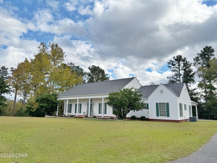 Welcome to your dream home! Nestled on a quiet dead-end street, this 3-bedroom, 2-bathroom gem offers the perfect blend of tranquility and convenience. Located near Marianna High School, K-8 schools, and the sports complex, this property is ideal for families or anyone seeking a serene yet connected lifestyle.

Step inside to discover a thoughtful split-bedroom floorplan with soaring ceilings—13 feet in the living room and 11 feet in the dining and entry areas—that create an open and airy feel. The spacious laundry room provides ample storage, ensuring your home stays organized and clutter-free.

The master bedroom is a true retreat, featuring a large walk-in closet and an abundance of natural light. Outside, a southern-style front porch invites you to relax in a row of rocking chairs, soaking in the peaceful surroundings.

Enjoy seamless indoor-outdoor living with a covered breezeway connecting the carport to the back door and the fenced private pool area, perfect for entertaining or simply unwinding in your private oasis.

Don't miss your chance to own this beautifully designed home in a prime location—schedule your tour today!