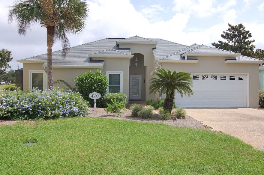 Beautiful 3 BR/2 BA home with two car garage in the gated community of Bay Point .  Screened in back porch and on a cul-de-sac.  Home has tile floors, trey ceilings, fireplace, fully equipped kitchen, laundry room.  It over looks the Nicklaus golf course and pond.   Bay Point Legend Place properties are truly unique in that they have both the comfort of a home and the worry free lawn maintenance of a condo.  Come enjoy your own piece of paradise here in Panama City Beach, FL.