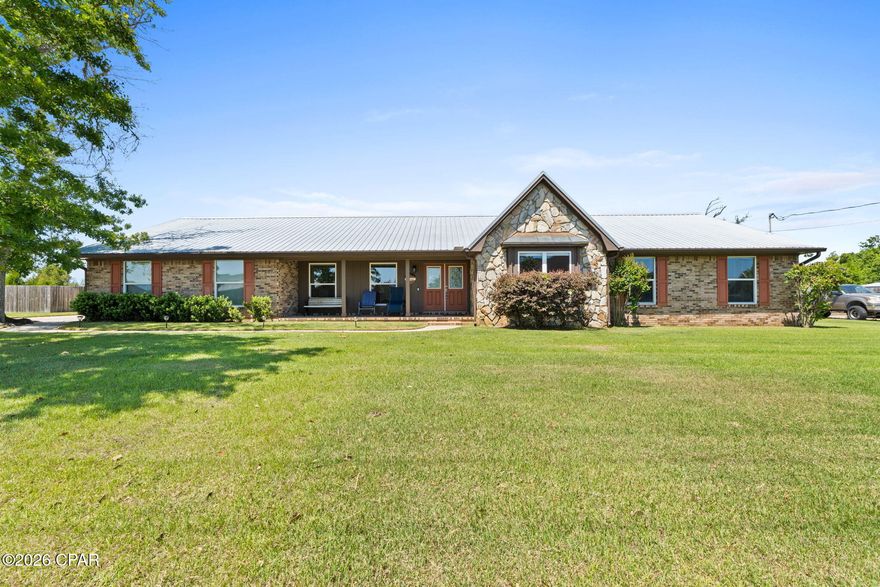 Don't miss this beautiful Lynn Haven home in College Point with a sparkling pool.  This 4 bed 2 bath home is generously located on over a half acre and is spacious at 2,765 sf.  You'll love how large the rooms are and how much light is in the home.  You have an office/flex room and a formal dining room at the front of the home and an open kitchen/dining/living space in the back overlooking the inground pool.  There is a wood burning fireplace as a focal point in the home.  Laminate vinyl plank is throughout making it easy to care for.  Other highlights include a beautifully remodeled kitchen with stainless steel Kitchen Aid appliances and quartz countertops, a large laundry/utility room with sink, remodeled master bathroom with tiled shower, large screened porch with bbq grill, garage with pull down attic stairs, large storage closet, sprinkler system, gutters, large front porch, and double gate to backyard.  Metal roof - 2019, Water Heater- 2023, HVAC with air scrubber- 2019, Septic/Drainfield/Sump Pump - 2013, New Well and Pump- 2024, Appliances - 2019, Pool Pump and Sand Filter- 2024.  Termite bond through Brock Pest Control is transferable. Ring cameras located in front, back, side and driveway are hard-wired and will stay. Water softener is owned.  Make plans to see this one today!