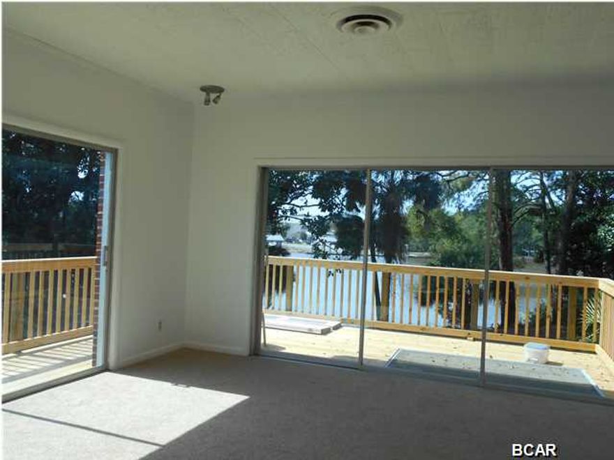 Don't miss out on unlimited fishing and the great opportunity for Seller financing on this Waterfront property! This property has water views from just about every room! This spacious brick home sits on just over a 1/2 acre lot, with just over 2000+ sq. ft. of living space and many original features of an older home including original hardwood flooring, while having many updates as well. Newer AC/Heating unit, new tile in kitchen and laundry room, with a side by side fridge as well as a flat top stove. A spacious L shaped heated/cooled Florida room has a with water view would be perfect for a home business or just extra living space, triple sliding glass doors in the main bedroom, accesses a spacious deck overlooking the beautiful Bayou. A master bath, and two cedar closets, newer