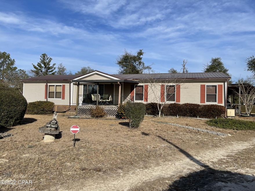 Under contract - taking back up offers. Very well maintained doublewide mobile home on approximately 2 acres in Fountain. The home boasts 3 bedrooms and 2 baths with walk-in closets in all bedrooms and a wood burning fireplace. There is a sunroom off the living room and a nice covered back porch.  There is a large tool shed, a greenhouse, 2 covered shelters, a greenhouse and a burn barrel on the property.  Property is completely fenced with 2 double gates.  Washer, dryer, stove, microwave, and tv in master bedroom convey. There is also a whole house generator and a Culligan water treatment system that convey.  The ac/ heat, hot water heater, metal roof, and back porch are newer. There is a separate parcel ID for the second acre. #01084-020-000.