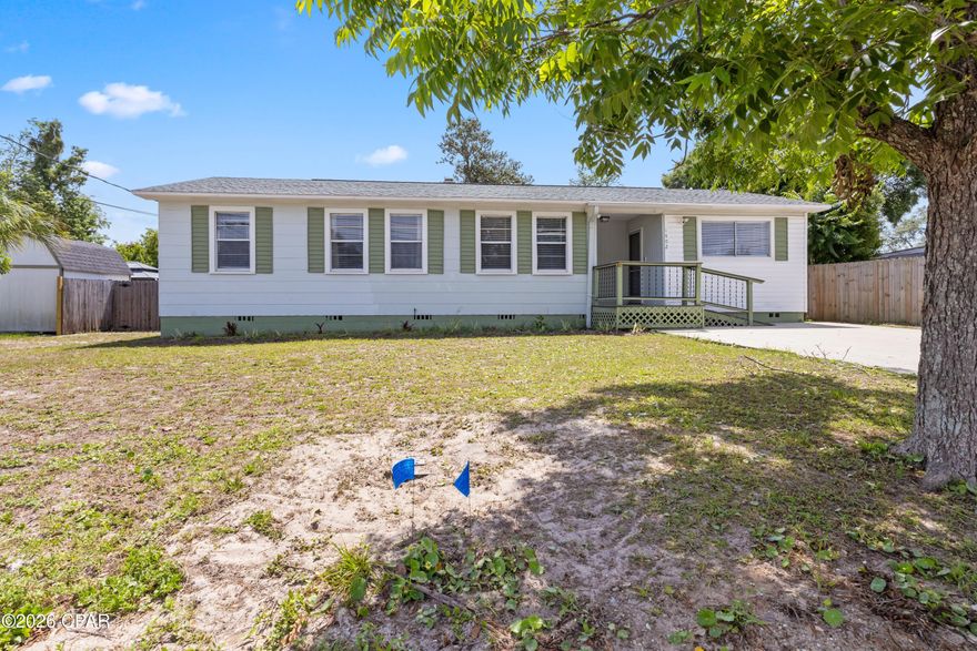 This updated Florida Cottage combines character, natural light, and a location that can't be matched.  With 4 good sized bedrooms, 3 bathrooms, and approximately 1,800 square feet, the home has an open, comfortable feel with large windows throughout that bring in sunlight from nearly every room. The layout includes a spacious living area, updated finishes throughout the home, and a separate entrance to the connected mother-in-law quarters, offering flexibility for extended family or use as a large master-suite. Out back, the large privacy-fenced yard offers plenty of room for kids, pets, entertaining, or storing a boat or RV. The oversized patio creates a great outdoor gathering space, while the detached storage building with electricity is perfect for tools, hobbies, or additional storage. Located just minutes from Beach Drive, Historic St. Andrews, and Downtown Panama City, this home is right in the middle of everything while still tucked into an established neighborhood. The street has recently been paved and updated with new sidewalks, adding to the area's charm and walkability. Both Tyndall Air Force Base and the Navy Base are a short drive away, and the white sandy beaches of Panama City Beach are only about 20 minutes from your front door. If you've been looking for a home with charm, functional space, and a central location close to shopping, restaurants, marinas, and the water, this one is worth a look!
If you love the neighborhood 1403 Arthur Ave is also for sale.