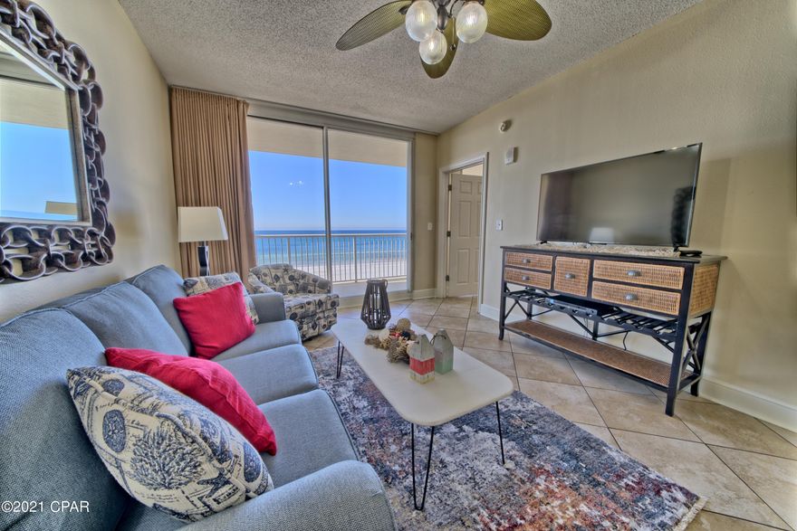 ***ABSOLUTE MUST SEE!!**** This 3 bedroom 2 bath condo with a GULF FRONT MASTER SUITE which boasts almost 1300 sq. ft of SUPERB GULF FRONT LIVING is located on the HIGHLY DESIRABLE 3RD FLOOR. This FANTASTIC floor plan has CUSTOM TILE throughout the entire condo, a gulf front master suite with a private mirrored vanity area, MASTER BATH double sink vanity, separate shower and a Jacuzzi tub. The GULF FRONT living area is equipped with a wet bar & wine cooler, walks on to a large double balcony with FANTASTIC GULF VIEWS, a kitchen with an island, a FULL SIZE WASHER & DRYER and is being SOLD FULLY FURNISHED and RENTAL READY!!. MAJESTIC BEACH RESORT is one of PCB's finest condo communities with unsurpassed amenities which include 3 LARGE outdoor pools, 2 indoor pools, fitness facility, theater, tennis court, H2O poolside bar & grill and a Starbucks Deli. Don't let this once in a lifetime opportunity to own your piece of PARADISE pass you by!