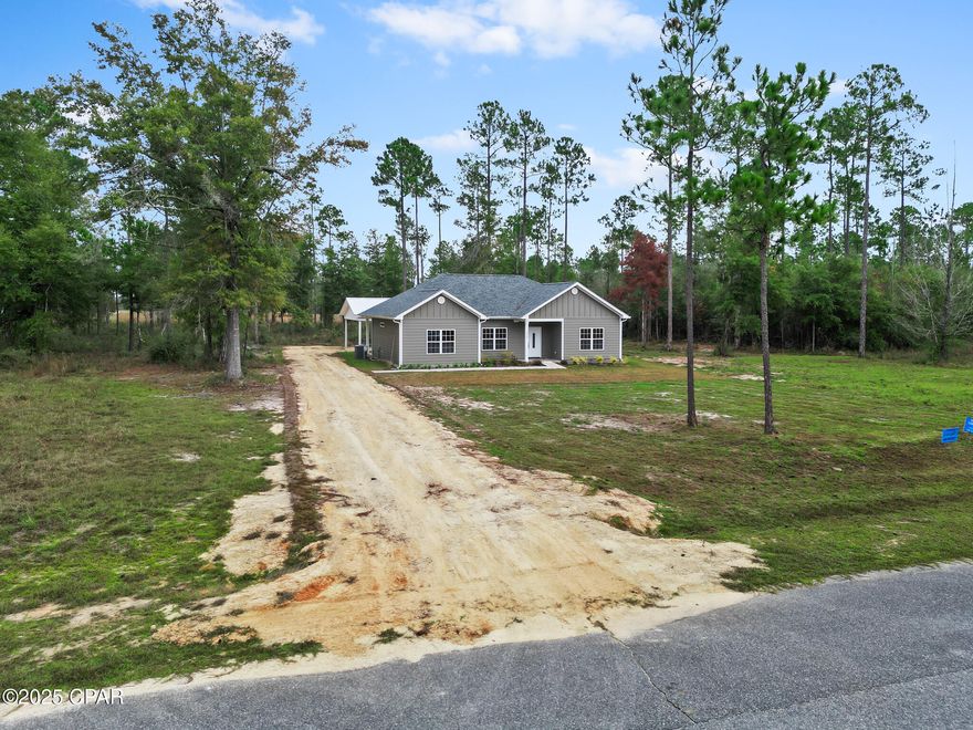 Brand-new 2025 construction on 1.96 acres in the highly sought-after Blue Springs Plantation subdivision! This beautifully designed 3-bedroom, 2 bath home features durable Hardie Board siding, a modern, open layout with LVP flooring, granite countertops, soft-close cabinet drawers, and 9-ft and 12-ft ceilings that create a bright, spacious feel. The kitchen features stainless steel appliances and a functional layout perfect for everyday living.

The home includes large bedrooms, double vanities in the bathrooms, a covered back porch for relaxing outdoors, and a detached 2-car carport. Enjoy almost 2 acres of peaceful living while staying close to town.

Located just minutes from the popular Blue Springs Park and about 15 minutes from Marianna schools, this home offers the perfect blend of privacy, convenience, and high-quality new construction.

Move-in ready and built to last—this one won't last long!