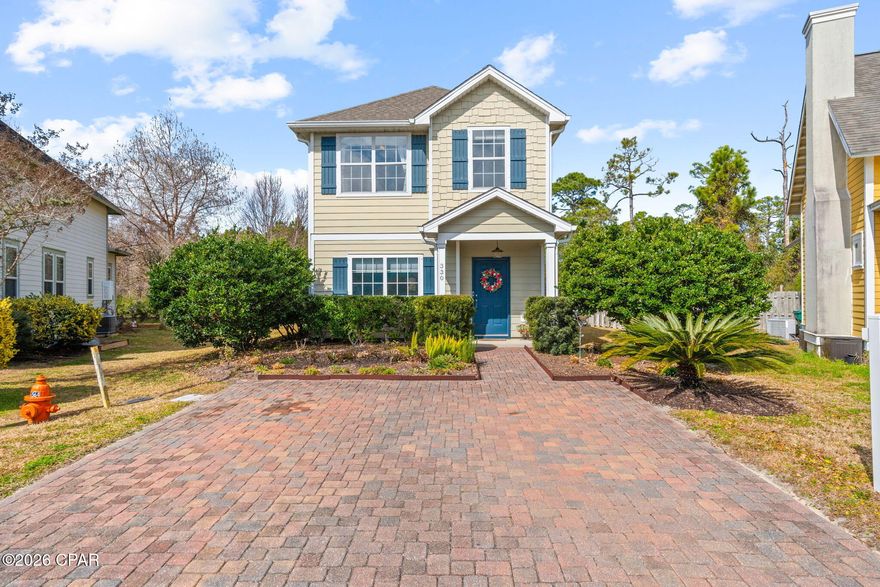 Discover the best location in Harrison's Walk, a charming community of coastal craftsman homes just minutes from everything Panama City Beach has to offer. With no homes directly behind you—only peaceful green space—this property delivers a rare sense of privacy while still being less than ½ mile to the beach and Shipwreck Island Waterpark, and right around the corner from Lowe's, Publix, restaurants, and area schools. Pier Park is also less than five miles away, making this one of the most convenient addresses in all of PCB.

This beautifully maintained Florida cottage shows true pride of ownership, with meticulous care evident throughout. The inviting open floor plan provides excellent flow, with the main living area opening into a spacious, well-appointed kitchen featuring high-end cabinetry, stainless steel appliances, a center island, granite countertops, and abundant storage and counter space. Additional interior features include large closets, tons of storage, an open kitchen layout, and a large walk-in primary closet.

Enjoy a serene waterfront-view backyard, an easy-to-maintain yard, a brick patio porch, and a sprinkler system, creating the perfect setting for relaxing outdoors. Harrison's Walk also offers a nice gated community pool for residents to unwind and enjoy. The HVAC is only 2 years old, all major appliances convey, and furniture is negotiable—making this 3-bedroom, 2.5-bath home truly turn-key.

Homes in this location rarely come available—don't miss your chance to own in one of Panama City Beach's most centrally located and desirable neighborhoods.

All measurements are approximate; please verify if important.