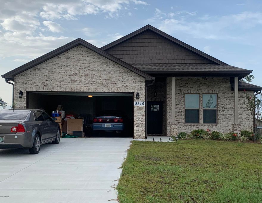 Stunning new construction home on large lot in popular  Lynn Haven only 2 blocks from boat ramp & park. This beautiful home has all the upgrades you would want. The 9' ceilings feature step up tray ceilings throughout, split floor plan, beautiful crown molding, thick baseboards, LED lighting, vinyl plank flooring, double pane windows, security lights, recessed lighting, upgraded fixtures and tasteful wall trim. The great room is perfect for entertaining and the open kitchen has plenty of room for guests. The kitchen features custom cabinets, quarts counter tops, stainless appliances, island sink with breakfast bar, & custom pantry.  Photos are from previously built home.  Quick contract gets buyer time to pick wall color! Construction to be completed by mid to late August. The master bedroom offers plenty of natural light with step up tray ceiling, while the master bath offers double vanity, large walk-in closet and a huge custom shower.  The exterior of the home offers a sprinkler system, covered front and back patios.  There are no HOA fees and the home is close to Lynn Haven shopping, Lynn Haven Recreation Center, Bay Haven, North Bay Haven and Mosley High School.