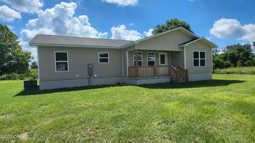 Welcome to your NEW construction home built by Jensen Homes! A VA Approved home builder! This 3/2 home is situated on almost a half-acre lot in the town limits of Grand Ridge, FL.  City water and city sewer.  This 3-bedroom 2 bath home features a split floor plan with Master Bedroom and bath down one hallway, and the additional 2 bedrooms and guest bath are on the opposite side of the home insuring privacy for all.  All windows and doors are LOW E energy rated.  House has R13 insulation in walls and R30 in the attic. New Carrier heat pump for those hot summer days and those cool winter evenings. Each bedroom, as well as the front room, have ceiling fans.  The kitchen is already prepped for a ceiling fan should you chose to install one. The Master bedroom features his and her closets which both have closet organizers installed. The Master bath features a gray double vanity sink with solid surface countertop and sinks and a bath/tub combo and a recessed toilet area.  Both bathrooms have 12 x 24 ceramic tile as well as the laundry room and in the kitchen as well.  The front room has wall to wall carpet as well as in both hallways and in all 3 bedrooms.  Never be left out of the football games or movies while preparing meals and snacks in this kitchen with the wide open one room kitchen and family room.  The kitchen features all Stainless-Steel Samsung appliances to include a French door refrigerator, electric smooth top stove, above stove microwave, and 3 rack dishwasher.  The kitchen cabinets are white and are adorned with crown molding for accent.  Double bowl deep stainless sink  rounds out the kitchen.   The 2 separate guest bedrooms both feature large double door closets with closet organizers as well.  In the guest bath you will find the same ceramic tile as in the kitchen and the Master bath.  Home has been Pretreated for Termites thru A and J Pest Service and includes option for annual renewals. The front porch faces west for enjoying those spectacular Florida sunsets!  Call now to schedule your showing.