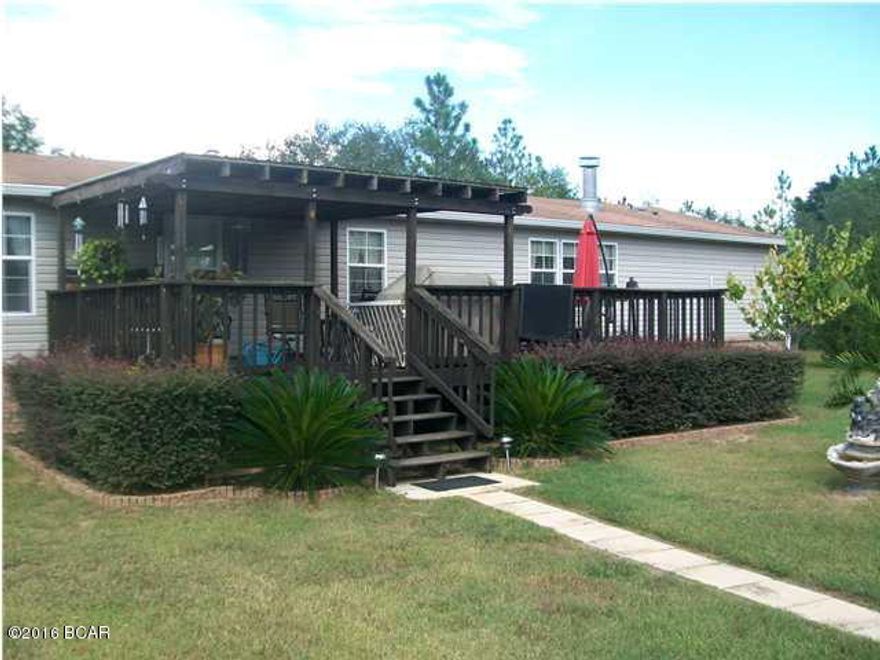 5.27 ACRES WITH A VERY NICE 1664 SQ FOOT 3/2 MOBILE HOME WITH LOTS OF EXTRAS! TORNADO BUNKER ON PROPERTY CONSTRUCTED WITH BLOCK,CEMENT AND A STEEL DOOR. THREE CAR DETACHED GARAGE WITH ELECTRICITY, ONE BAY HAS BEEN CONVERTED INTO A OFFICE AND HUGE WORKSHOP, WITH EXTRA STORAGE IN A LARGE ATTIC. HOME HAS SPLIT FLOOR PLAN, ISLAND KITCHEN, BREAKFAST BAR, AND MUCH MORE. LARGE ABOVE THE GROUND POOL WITH DECK. POOL HAS BEEN PARTIALLY TAKEN DOWN BUT OWNER WILL PAY TO HAVE POOL PUT BACK UP AND RUNNING IF NEW OWNERS WOULD LIKE. PROPERTY HAS A GARDEN SPOT, AND IS NICELY LANDSCAPED. NICE, QUIET AREA AND IS A MUST SEE! OWNER IS MOTIVATED!!!